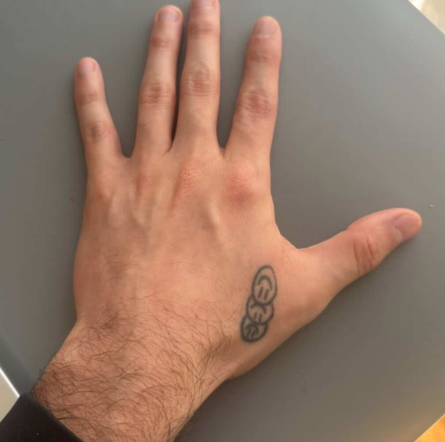 Small hand tattoo before cover-up