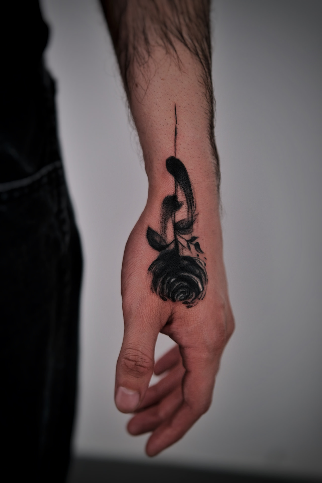 Blackwork rose hand tattoo after cover-up