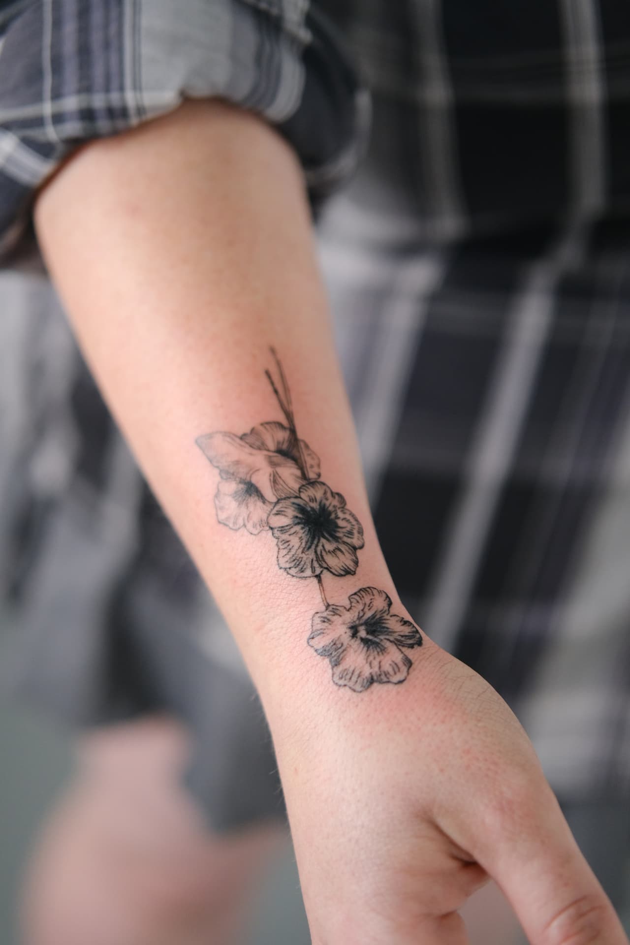 Floral wrist tattoo after cover-up